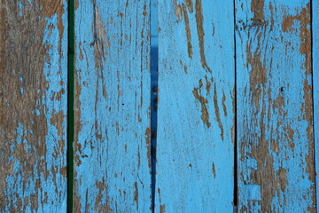 Fototapeta na wymiar Old wooden background has peeling paint.