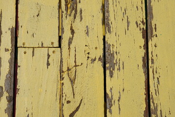 Old wooden background has peeling paint.