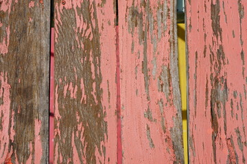 Old wooden background has peeling paint.