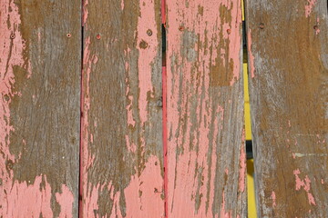 Old wooden background has peeling paint.