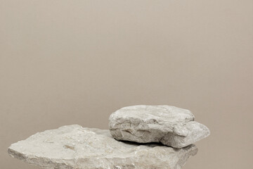 Stone Podium for promotion on beige Background. Natural pedestal. Two stone podiums. Beauty product...