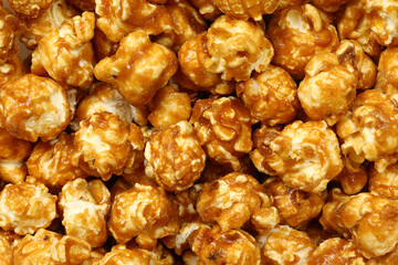 Caramel popcorn background, top view, flat lay