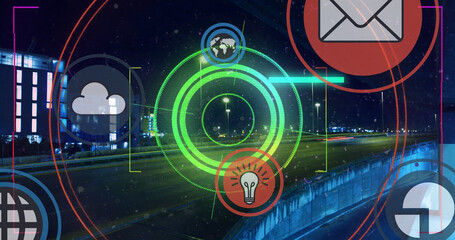 Multiple digital icons and neon round scanner against city traffic at night