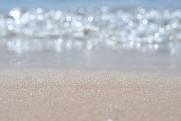 Sandy beach near sea on sunny day, closeup view