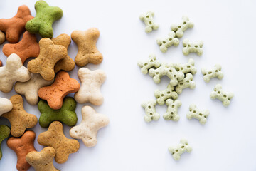 top view of tasty bone shaped cookies for dog isolated on white.