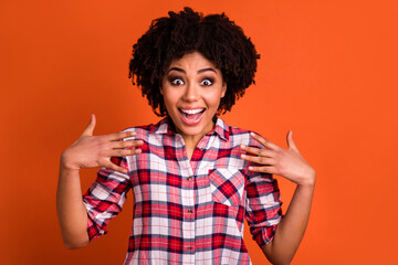 Photo of impressed crazy girl cant believe hands direct herself isolated on orange color background