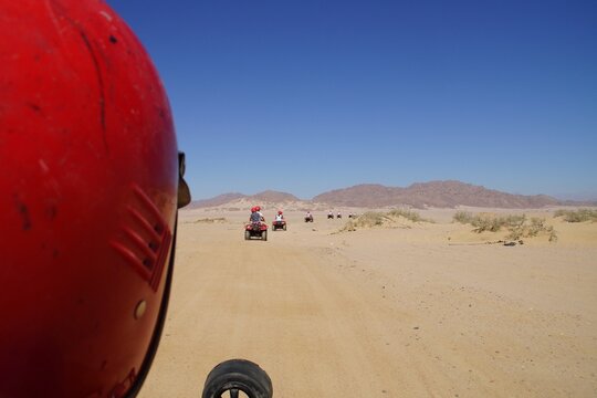 uad biking in the desert during the da