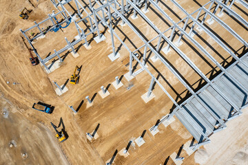 Factory Building. Aerial Industrial Construction Site with Cranes and Construction Equipment.