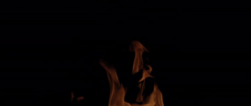 Fire Flames Igniting And Burning, Fiery orange glowing. Abstract background on the theme of fire. Real flames ignite. Royalty high-quality free stock footage of  flames isolated on black background