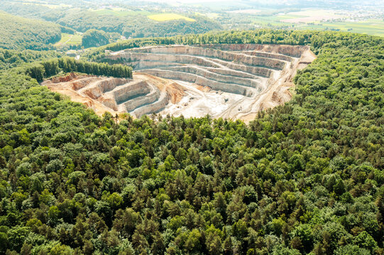 Dolomite Mine. Industrial Terraces. Aerial view of open pit mining. Excavation of the Dolomite Mine. Extractive industry.