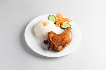 asian deep fried fresh crispy kampong chicken rice with cucumber and tomato in white background halal menu