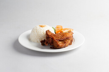 asian deep fried fresh crispy kampong chicken rice with cucumber and tomato in white background halal menu