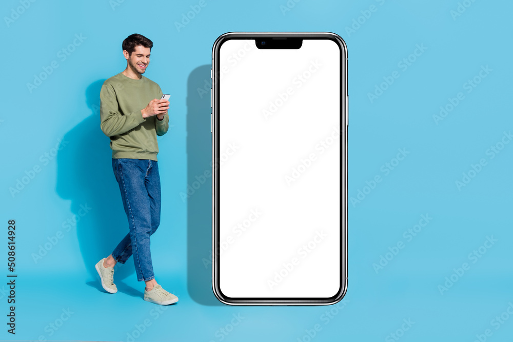 Poster full body portrait of positive person use telephone walk empty space blank isolated on blue color ba