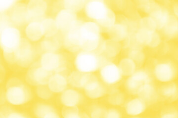 Obraz premium Defocused bright abstract yellow holiday background with shimmering sunspots. Bokeh. Holiday concept. Copy space for text.