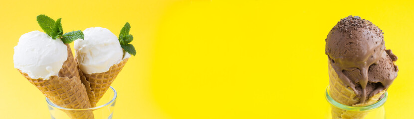 Banner. Close-up on chocolate and vanilla ice cream and in the waffle cone on the yellow background. Copy space.
