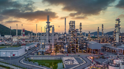 Oil and gas refinery plant form industry zone at night, Aerial view oil and gas Industrial petrochemical fuel power and energy.