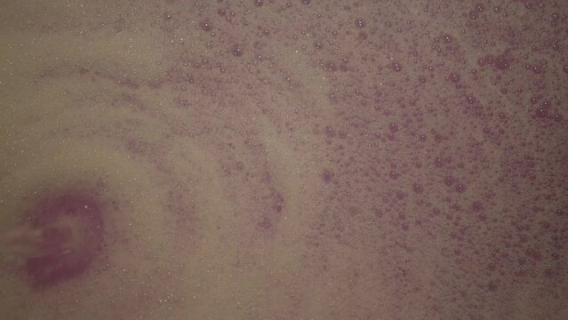 slow motion scene, bathtub with bubble bath bomb