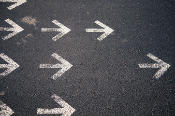 group of arrows marked on a street