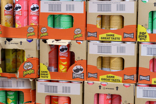 Tyumen, Russia-May 08, 2022: Pringles crisp snacks, variety of flavors on shelf of hypermarket. Pringles brand owned by Kellogg Company. Selective focus