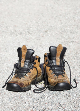 Well worn hiking boots of brown leather