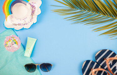 beach accessories with pastel colored background, summer arrives