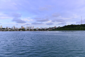 Fototapeta premium view of the river and the city, Natal, city ​​of the Sun, brazil, buildings seen from afar, Potengi river, natural landscape, horizon line, river meets sea, street background