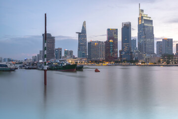 Landscape photo: View of buildings located on the Saigon River. Time: May, 2022. Location: Ho Chi Minh City.  