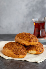 Cheese Pogaca. Turkish pastry product. Sesame pogaca on a dark background. Close-up. local name kasarli pogaca