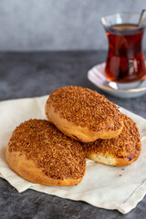 Cheese Pogaca. Turkish pastry product. Sesame pogaca on a dark background. Close-up. local name kasarli pogaca