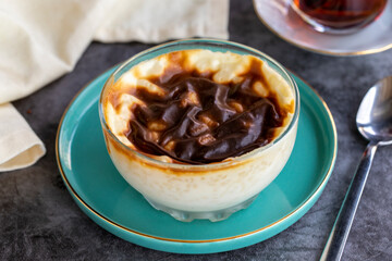 Rice pudding. Pastry product. Traditional Turkish cuisine delicacies. Milk dessert on a dark background. Close-up. Local name sutlac