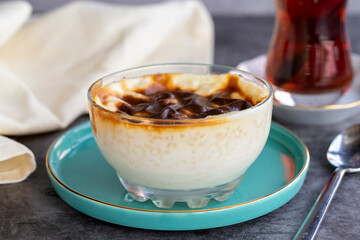 Rice pudding. Pastry product. Traditional Turkish cuisine delicacies. Milk dessert on a dark background. Close-up. Local name sutlac