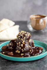 Profiterole cake. Pastry product. Profiterole cake on dark background. Close-up