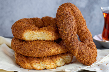 Sesame bagel. Turkish pastry product. Sesame bagel on a dark background. Close-up. local name susamli simit