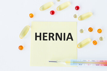 HERNIA text written in card with pills. Medical concept.
