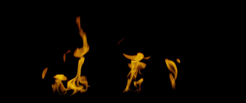 Fire Flames Igniting And Burning, Fiery orange glowing. Abstract background on the theme of fire. Real flames ignite. Royalty high-quality free stock image overlays flames isolated on black background