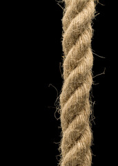 Natural hemp rope isolated on black background