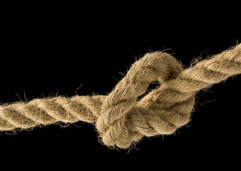 Hemp rope knot macro shot isolated on black background