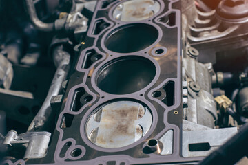 Obraz na płótnie Canvas Auto mechanic working on car engine in mechanics garage. the cylinder block. Automotive part,machine part Repair service. Automotive Car repair concept