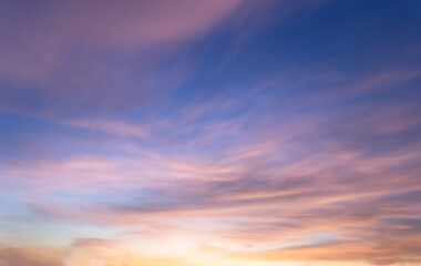 Beautiful sky painted by the sun leaving bright golden shades.Dense clouds in twilight sky in winter evening.