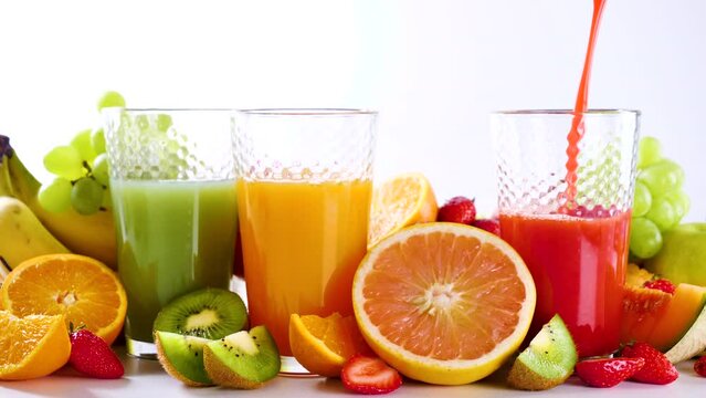 pour fresh fruit juice into glasses