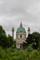 Fototapeta na wymiar Cloudy morning in Vienna with a baroque church