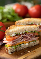 Ham sandwich with cheese, lettuce and tomato