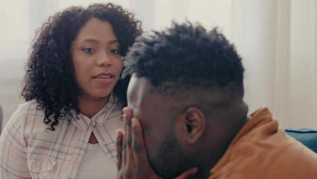 Displeased African American woman arguing with husband, relationship crisis