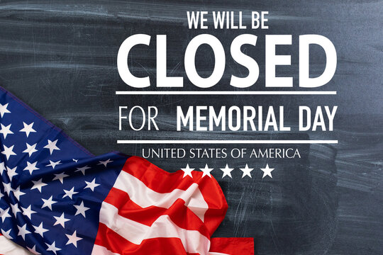 Veterans Day closed message with red, white and blue stars on burlap on a weathered whitewash wood.