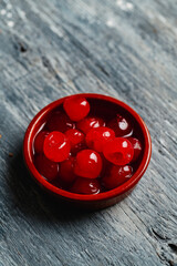 some maraschino cherries in a bowl - obrazy, fototapety, plakaty