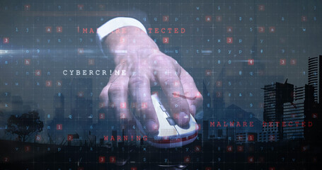 Image of cyber attack warning and hand holding mouse over cityscape