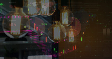 Image of financial data processing over lit light bulbs