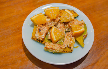 Grilled Tempeh and Roasted Pumpkin Salad Garnished with Orange and Sesame Vegan Soft Focus