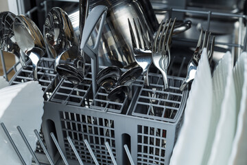 Washing dishes. dishes and pots in the dishwasher. well washed dishes