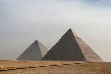 The great Egyptian pyramids. The deserted landscape with Khufu and Khafre pyramids.